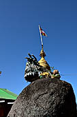 Myanmar - Kyaikhtiyo, several other stupas and shrines scattered on the ridge at the top of mount. 